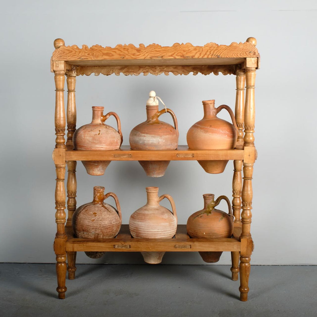 Antique two-tier, six hole water jug stand with original clay jugs, pine