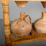 Antique two-tier, six hole water jug stand with original clay jugs, pine