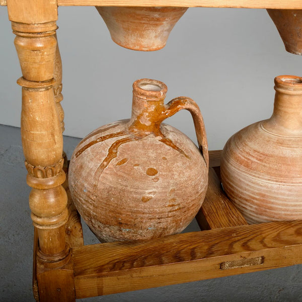 Antique two-tier, six hole water jug stand with original clay jugs, pine