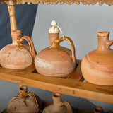 Antique two-tier, six hole water jug stand with original clay jugs, pine