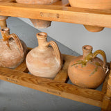 Antique two-tier, six hole water jug stand with original clay jugs, pine
