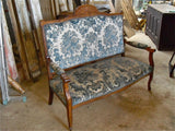 Antique Louis XIV-style settee in walnut