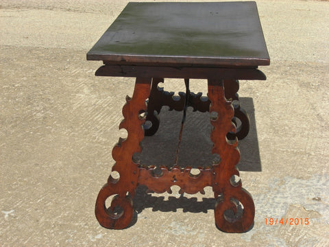 Antique folding scalloped-leg campaign table with iron stretchers, walnut
