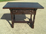 Turned-leg carved-drawer table in walnut and oak