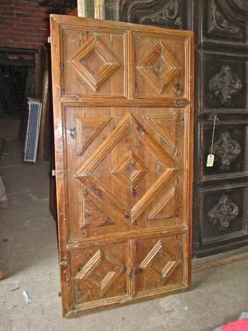 Antique single-panel arched door, honey pine
