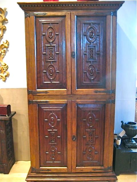 Carved reproduction four-door cabinet with Renaissance chain carving, cachimbo hardwood and reclaimed walnut