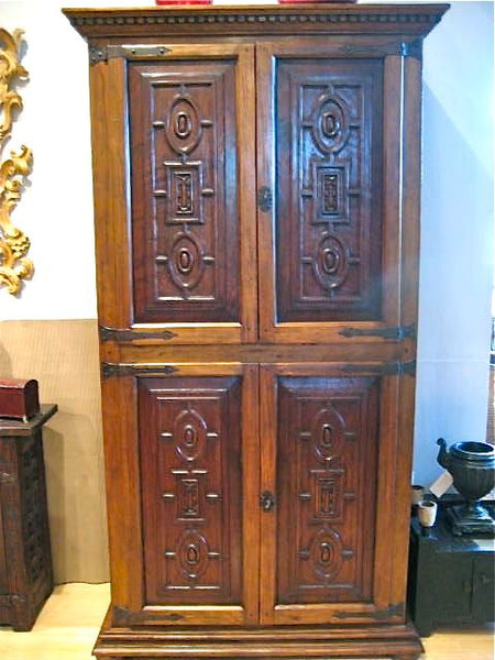 Carved reproduction four-door cabinet with Renaissance chain carving, cachimbo hardwood and reclaimed walnut