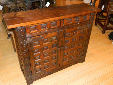 Carved reproduction four-door cabinet with Renaissance chain carving, cachimbo hardwood and reclaimed walnut