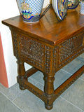 Carved two-drawer reproduction Spanish colonial library table