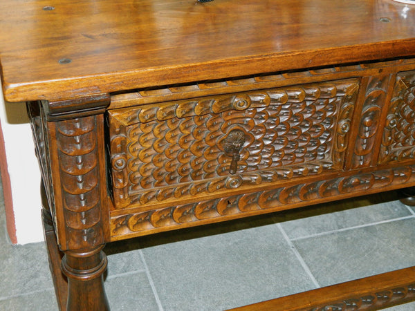 Carved two-drawer reproduction Spanish colonial library table