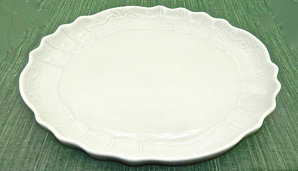 Small white refractory porcelain scalloped-edge serving platter