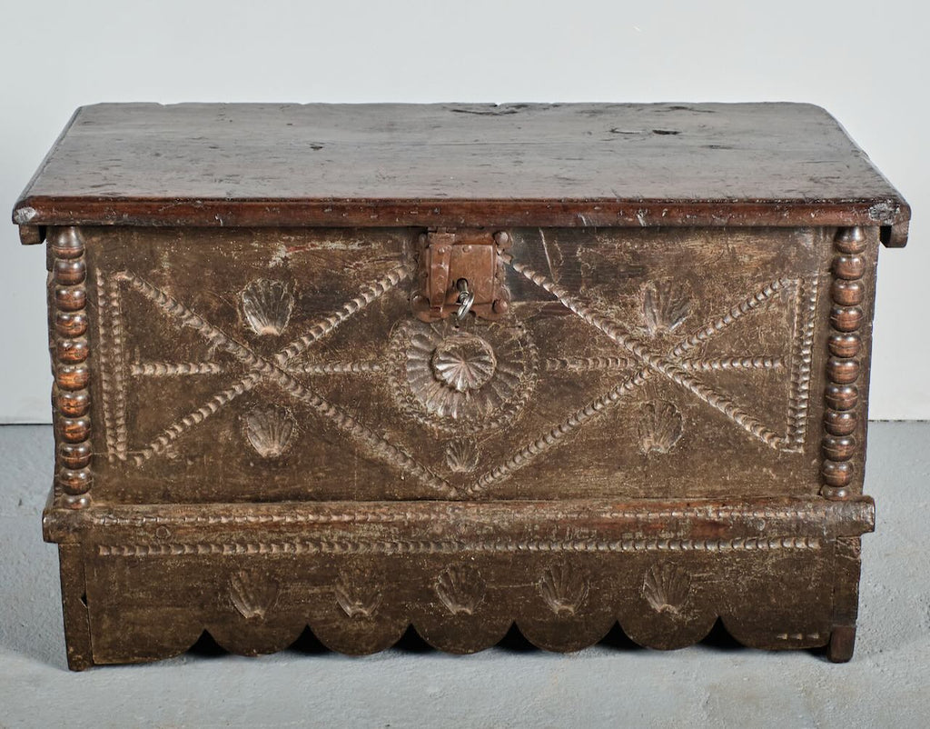 Antique scalloped skirt travel chest with carved shells of St. James, chestnut