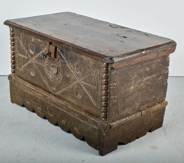Antique scalloped skirt travel chest with carved shells of St. James, chestnut
