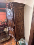 Antique two-door carved walnut cabinet on iron stand