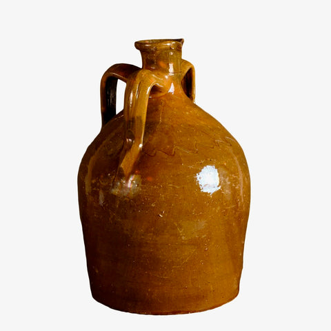 Antique glazed three-handle olive green liquor jug