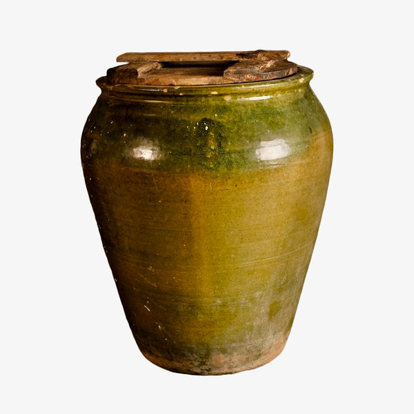 Antique small glazed green olive jar with wooden top