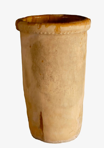 Antique clay cheese jar with glazed ochre interior