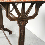 Antique iron bistro table with red marble top
