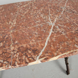 Antique iron bistro table with red marble top