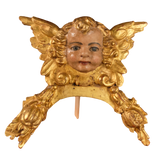 Antique carved, gilt and polychromed angel head with pomegranates