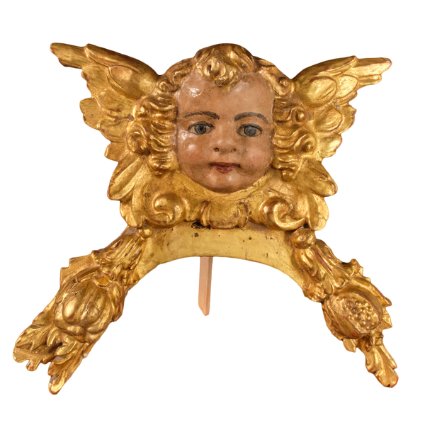 Antique carved, gilt and polychromed angel head with pomegranates