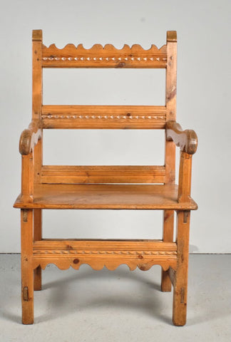 Antique carved Pyrenees arm chair, pine