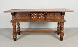 Antique heavily carved turned leg three-drawer library table, walnut