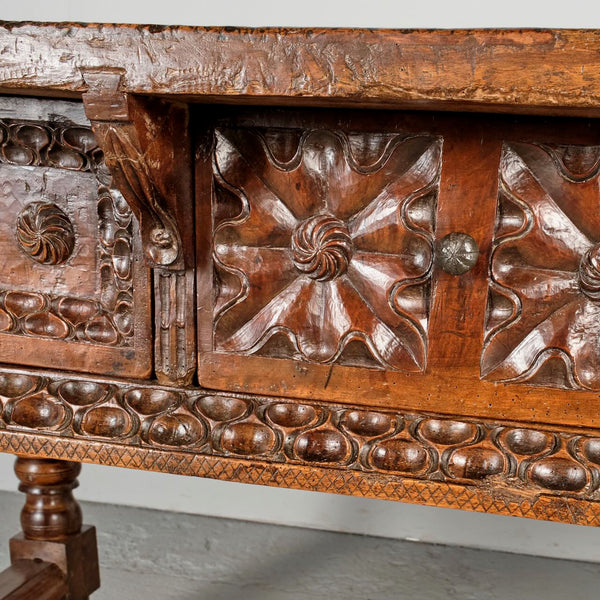 Antique heavily carved turned leg three-drawer library table, walnut