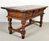 Antique heavily carved turned leg three-drawer library table, walnut