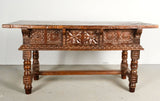 Antique heavily carved turned leg three-drawer library table, walnut