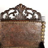 Antique carved tooled leather Spanish colonial arm chair
