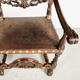 Antique carved tooled leather Spanish colonial arm chair