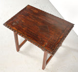 Antique carved edge trestle leg accent table with wooden center stretcher, pine