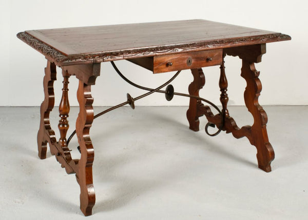 Antique carved edge lyre leg table with iron stretchers, mixed fruitwoods