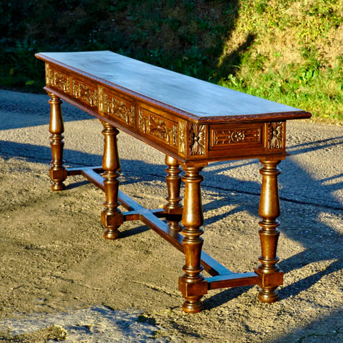 Long antique four drawer carved console table, oak
