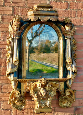Antique carved, painted and gilt mirror