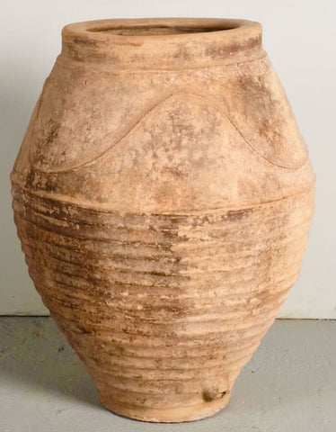 Large antique terracotta water jar with “waves”