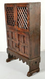 Small antique scalloped skirt four-door pantry cabinet with latticework doors, mixed woods