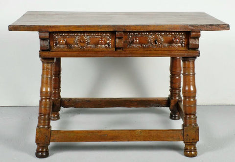 Antique two-drawer walnut table with inclined mast legs, walnut and elm