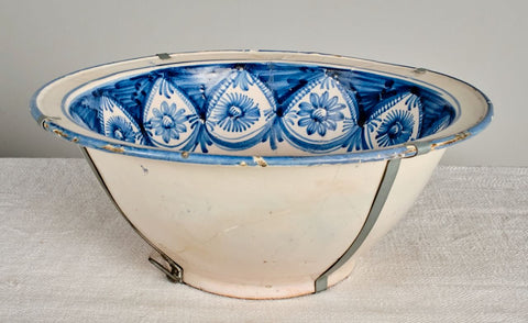 Antique painted and glazed blue and white “Manises” wash basin with floral motifs