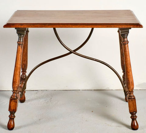 Antique turned leg chestnut accent table with iron stretchers