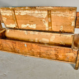 Antique painted village bench with lift-top seat