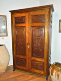 Reproduction two-door carved panel Basque armoire, walnut and cachimbo hardwood