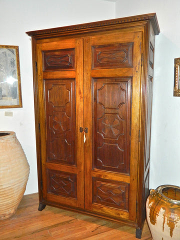 Reproduction two-door carved panel Basque armoire, walnut and cachimbo hardwood