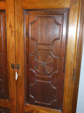 Reproduction two-door carved panel Basque armoire, walnut and cachimbo hardwood