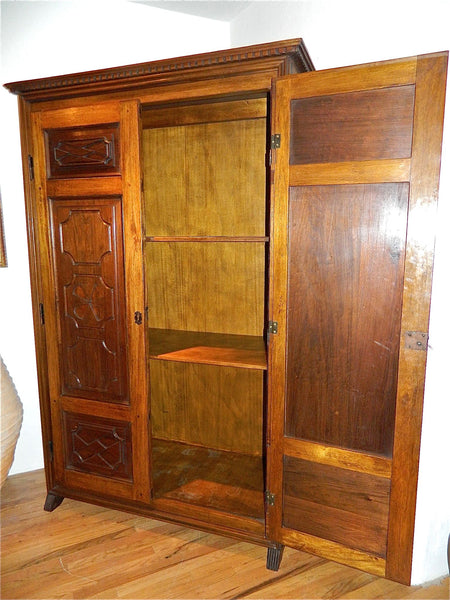 Reproduction two-door carved panel Basque armoire, walnut and cachimbo hardwood