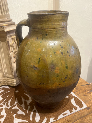 Single-handle, semi-glazed olive green oil pitcher