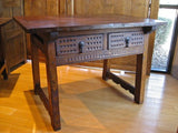 Carved two-drawer Renaissance-style table