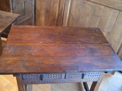 Carved two-drawer Renaissance-style table