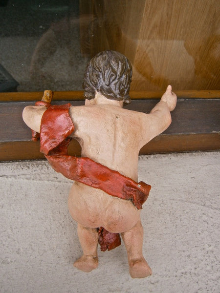 Pair of small carved and painted antique cherubs